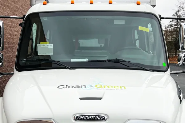 A CG installer applying vehicle graphics on site