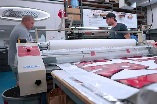 CG production floor with large-format printing in progress